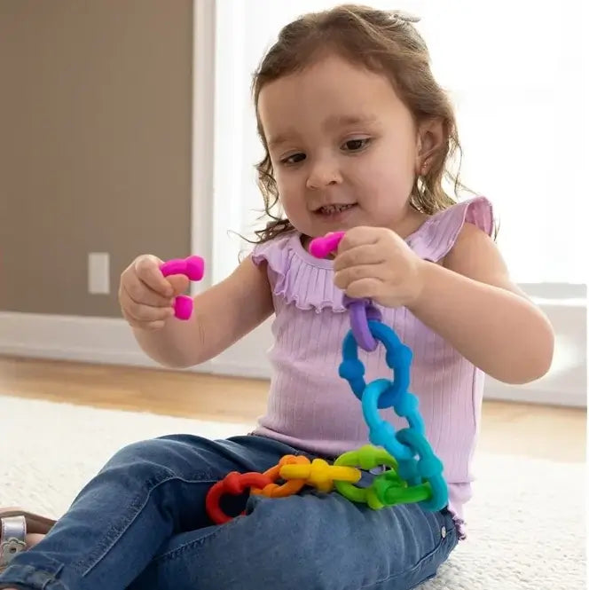Jeu Construction d'Anneaux Sensoriels fille joue