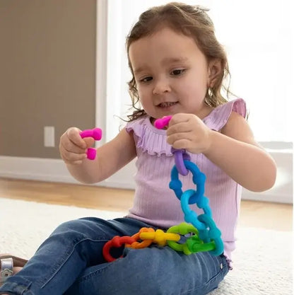 Jeu Construction d'Anneaux Sensoriels fille joue